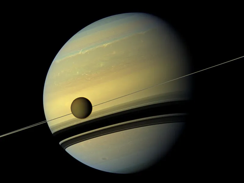 Titan and Saturn as seen from NASA's Cassini spacecraft.